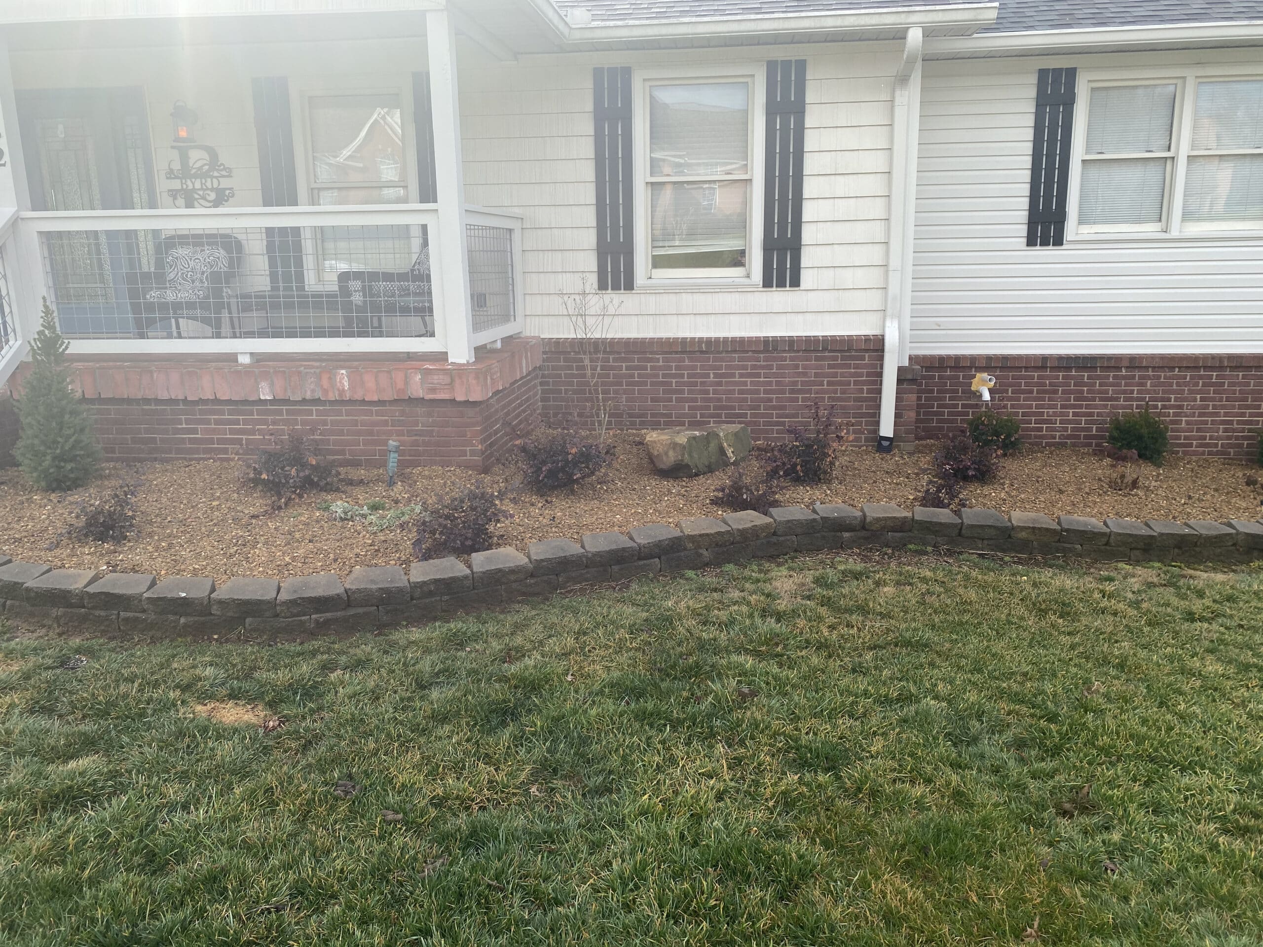 Flower bed with rocks around home 2 Appalachian Landscaping