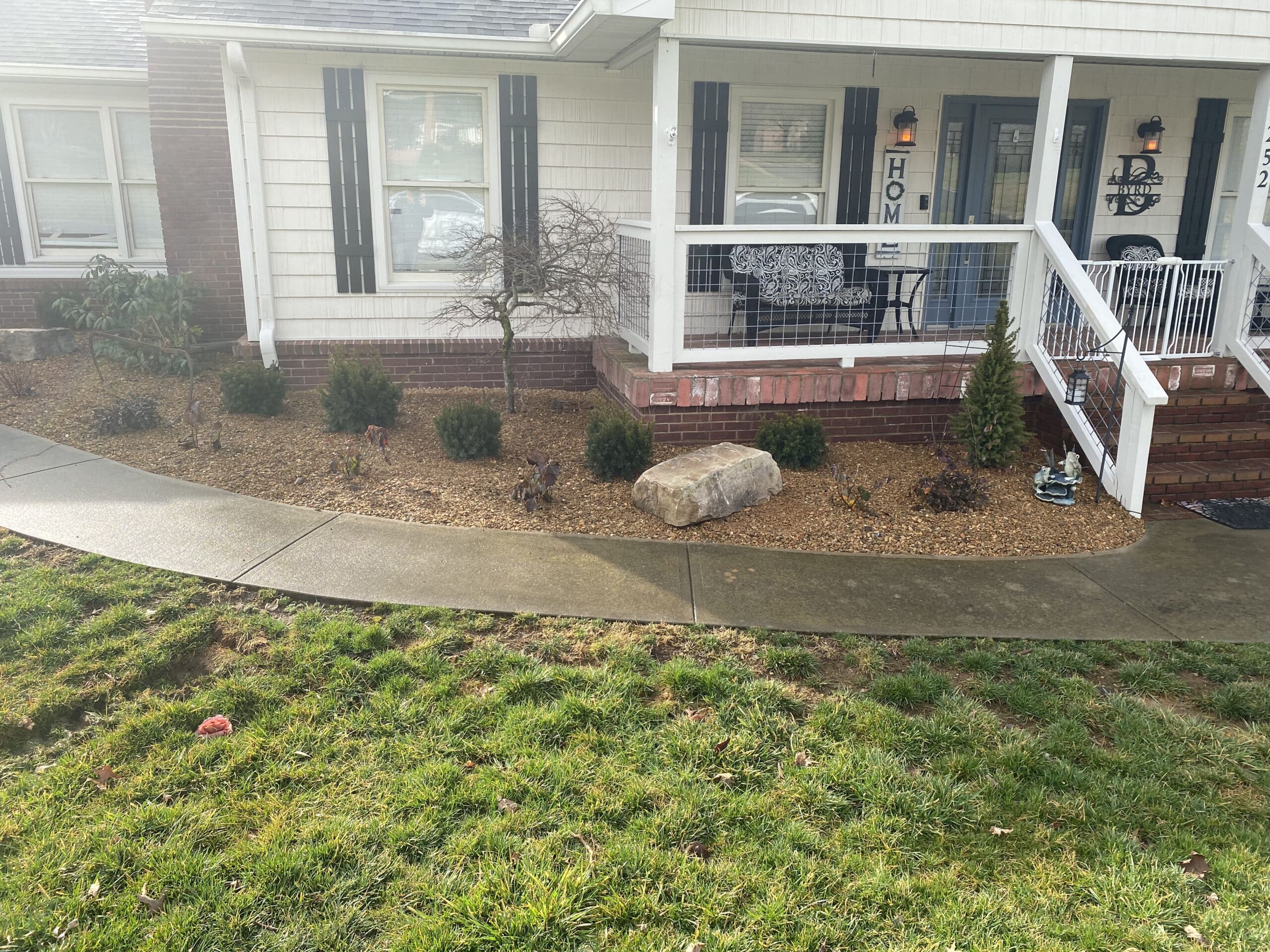 Flower bed with rocks around home Appalachian Landscaping