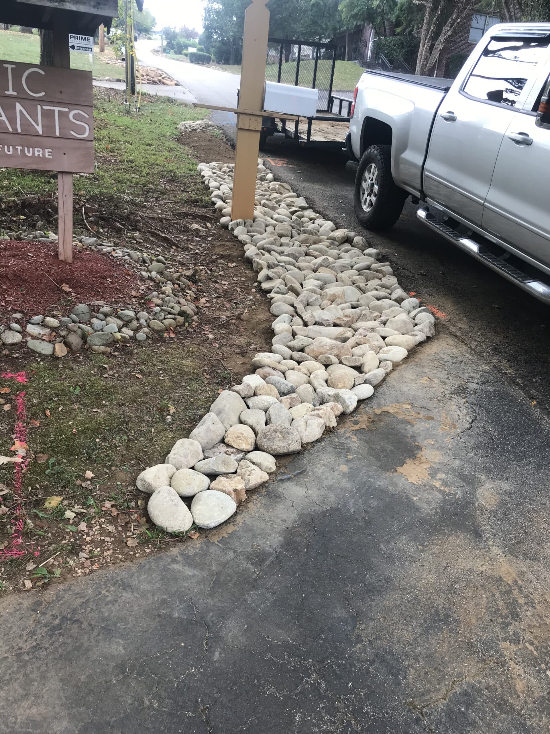 driveway lined with stones large paver walkway Appalachian Landscaping